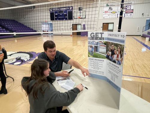 adult and students with display