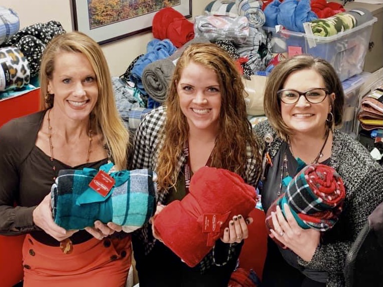 Women collecting blankets for charity