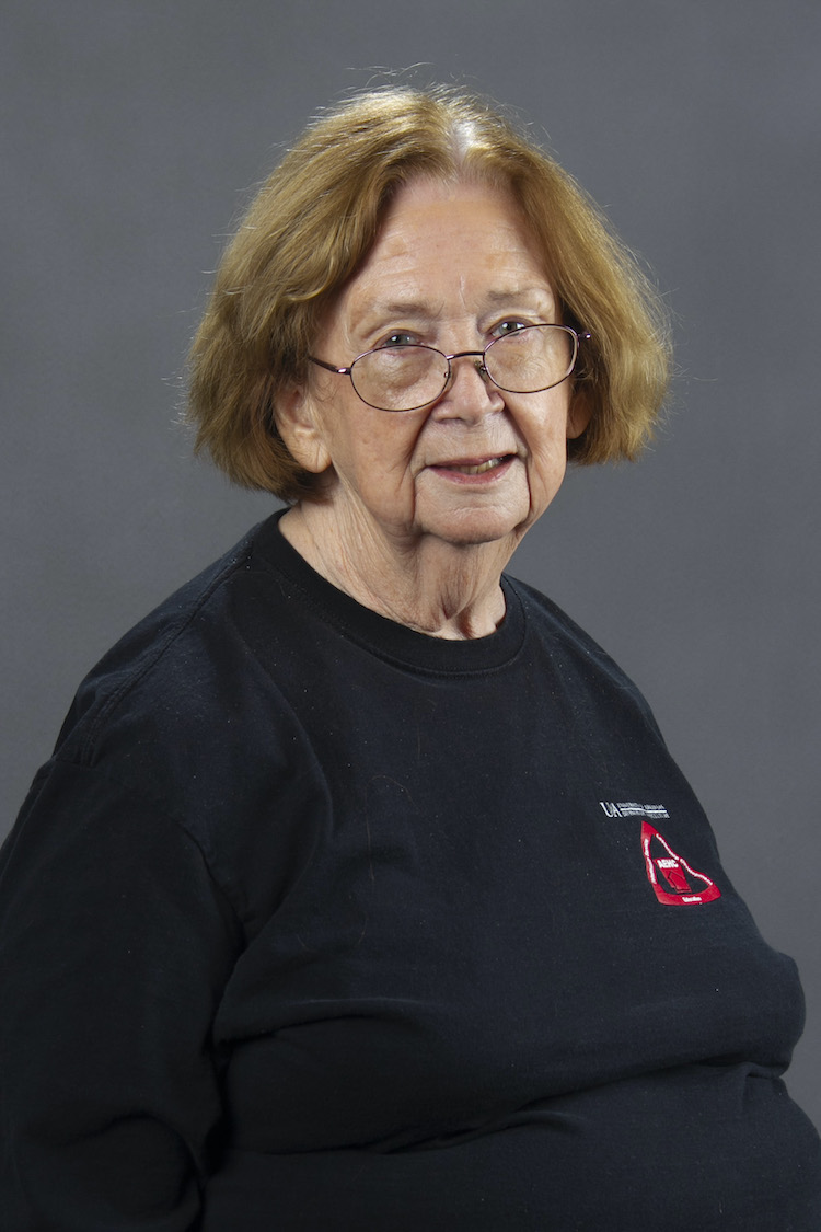 woman with glasses, smiling - Melody Curtis