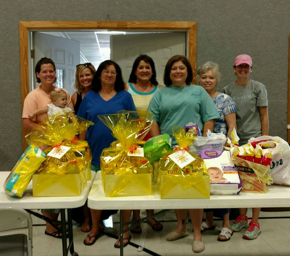 EHC volunteers with gift baskets EHC volunteers with gift baskets