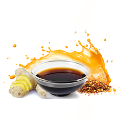 small container of soy sauce grouped with a piece of ginger root, red pepper flakes, and a splash of orange juice