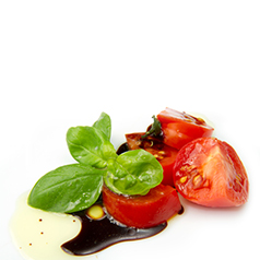 Diced tomatoes with a splach of balsamic vinegar and a sprig of basil