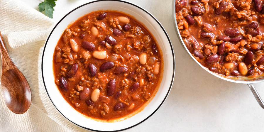 mixed dish of browned ground beef and beans in ketchup based sauce