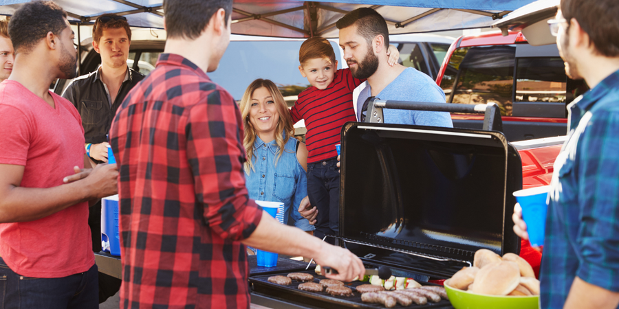 group of sports fans tailgating