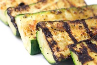 Zucchini cut lengthwise with dark grill marks