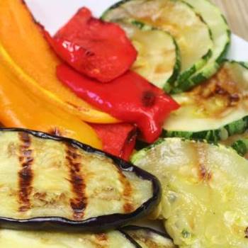 Grilled vegetables such as zucchini, eggplant, and red and yellow peppers