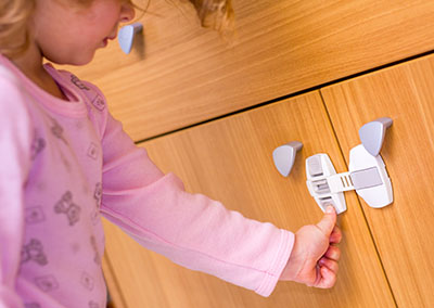 Child-proof latch on cabinet