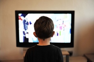 Young boy in front of television