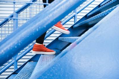 person walking up steps