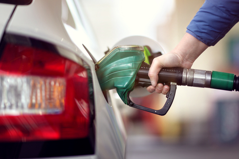 person pumping gas into their car