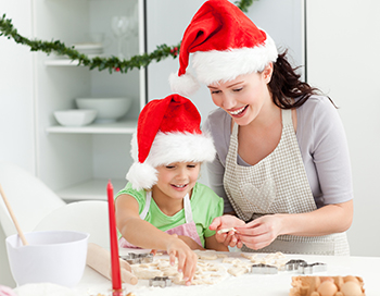 mother and daughter baking cookies