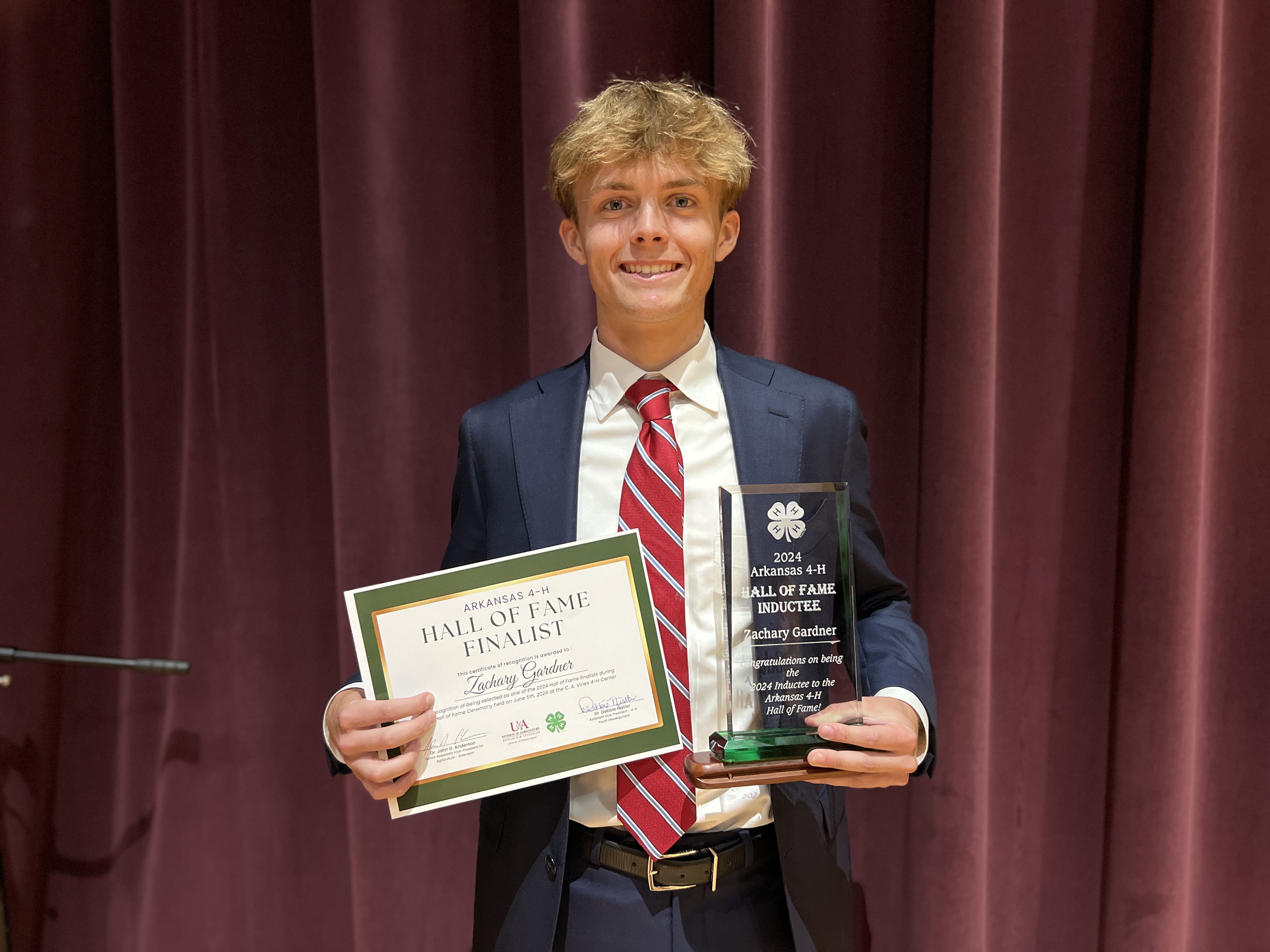 Zach-Gardner Zach Gardner holding Hall of Fame plaque and certificate