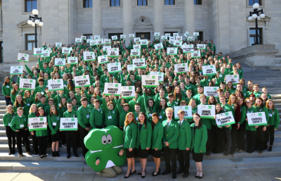 hundreds of 4H kids wearing green shirts standing on the Arkansas capitol steps