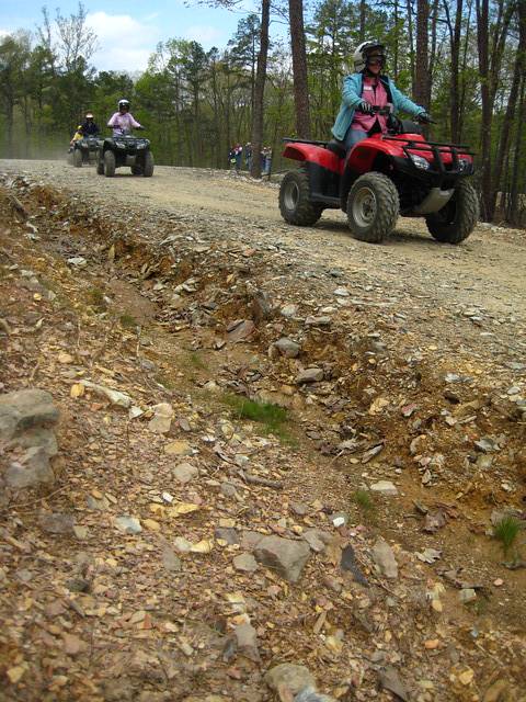 Picture of group learning about ATV safety, driving down in incline.