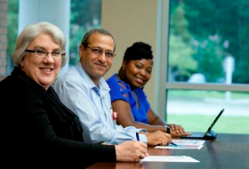 Three Extension employees - smiling