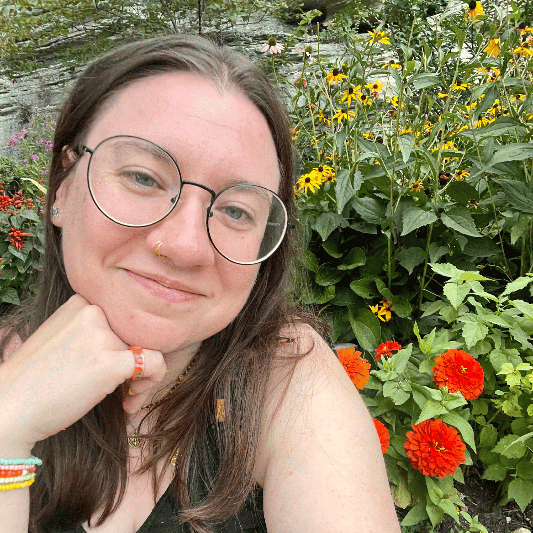 Melissa Johnson in front a garden