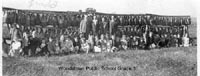 Picture taken in 1944 of a 3rd grade class with milkweed pods they collected.