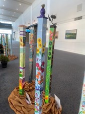 photo of a colorfully decorated spirit pole
