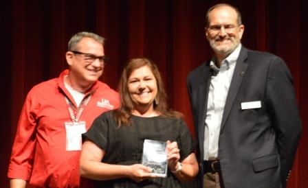 Amy Tallent receiving MG Extension Agent of the Year award from Randy Forst and Dr. Bob Scott