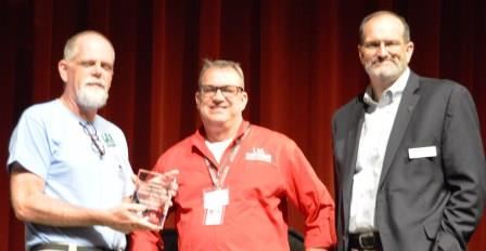 Photo of Colin Hester receiving MG Rookie of the Year Award from Randy Forst and Dr. Bob Scott