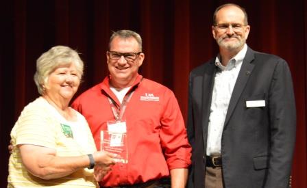 Michelle Lindley receiving MG Mentor of the Year award from Randy Forst and Dr. Bob Scott