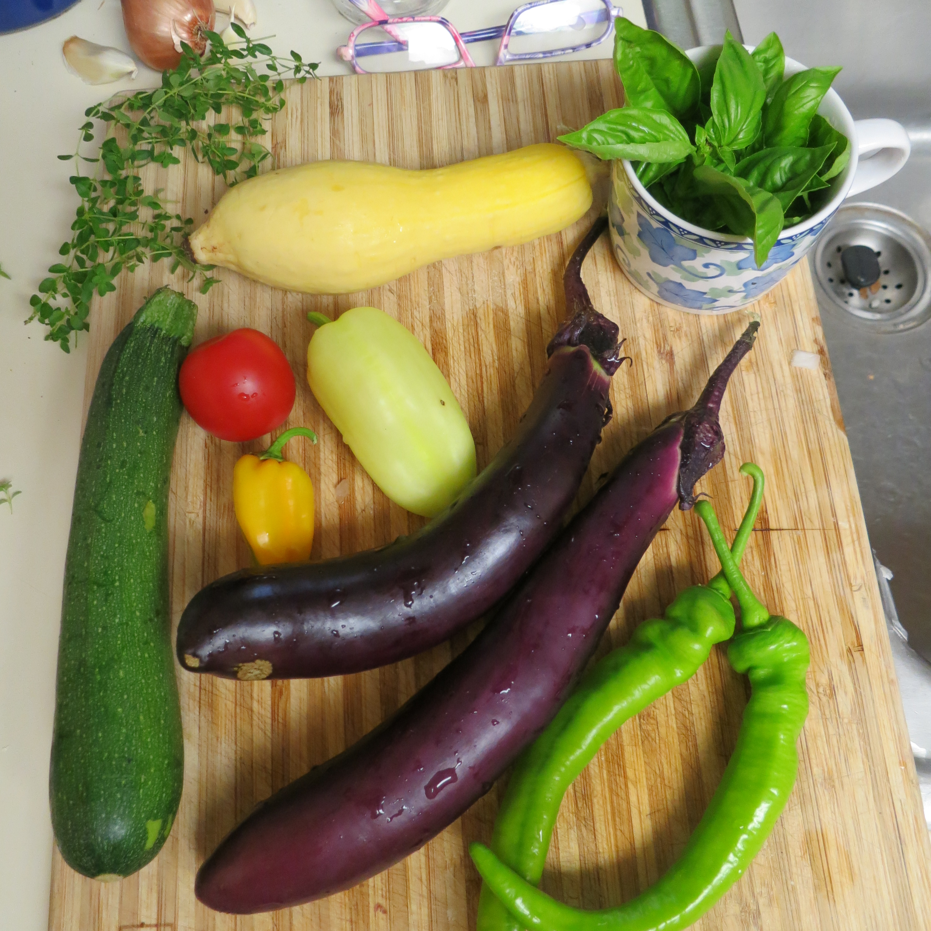 Photo of eggplant, squash and tomato